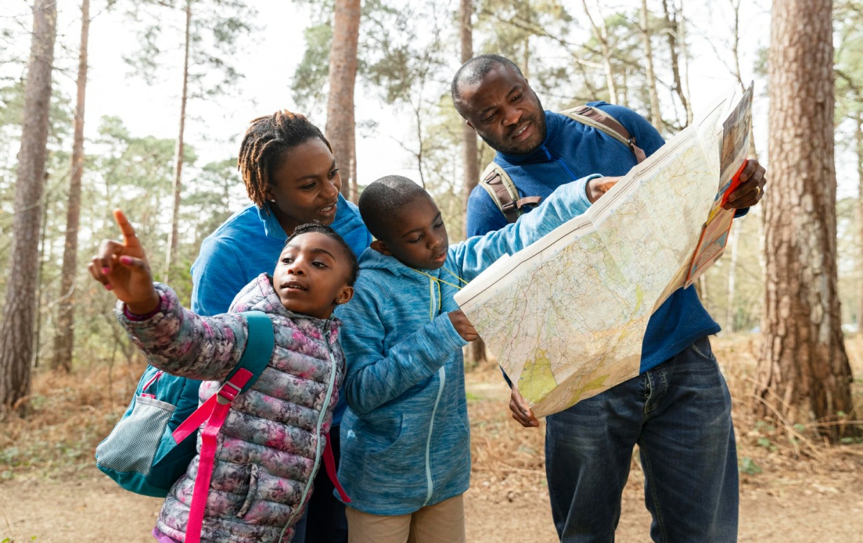 family-traveling-together-through-woods_resized